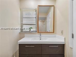 bathroom featuring vanity and radiator heating unit