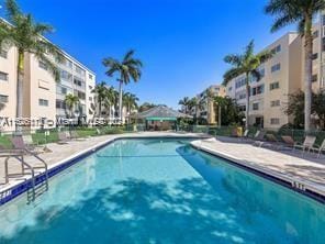 view of swimming pool with a patio