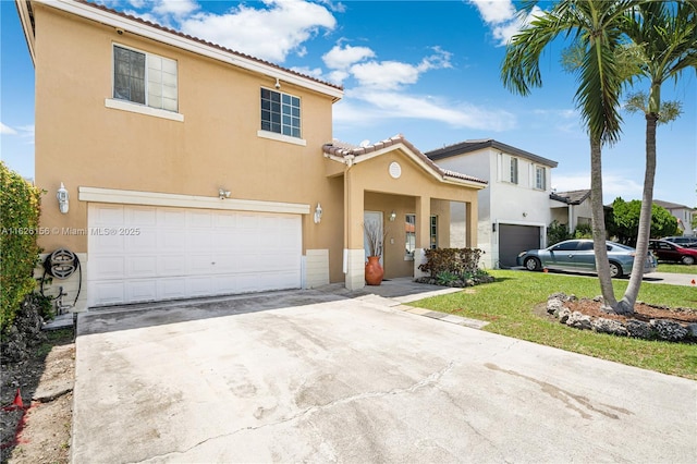 view of front of property featuring a front yard, stucco siding, a tiled roof, an attached garage, and driveway