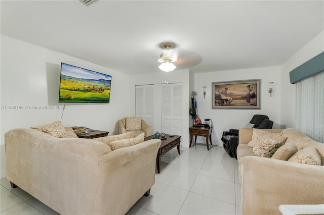 living room featuring ceiling fan and light tile patterned floors