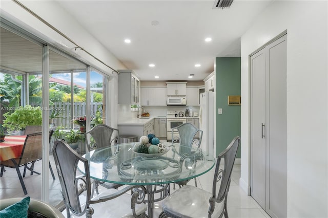 dining room with recessed lighting, visible vents, and light tile patterned floors