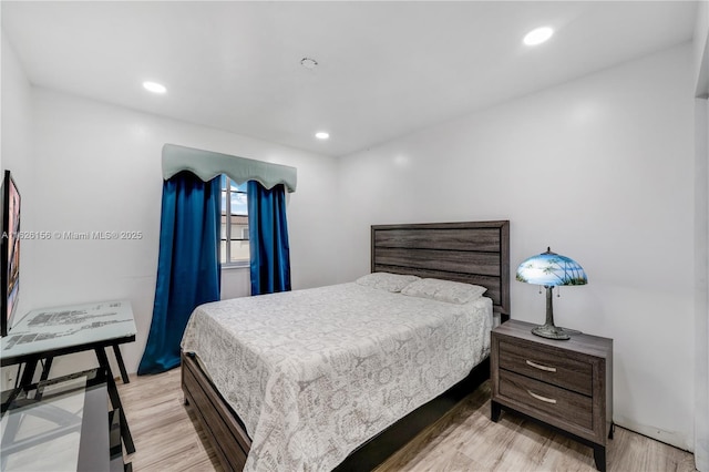 bedroom featuring light wood-style floors and recessed lighting