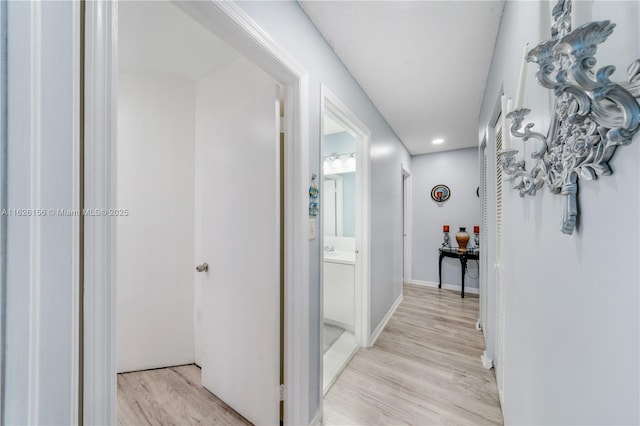 hall featuring recessed lighting and light wood-style flooring