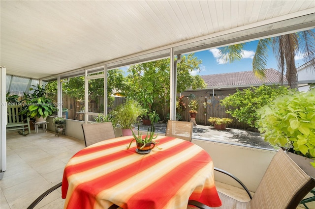 sunroom / solarium with tile patterned flooring