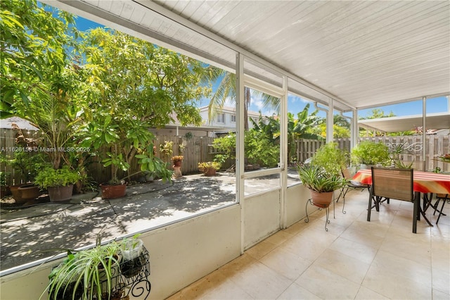 sunroom with outdoor dining space