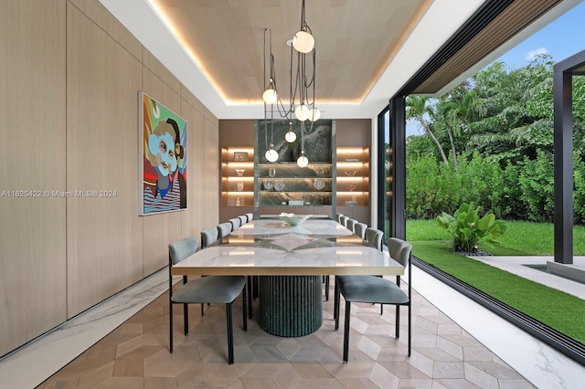 dining area featuring a tray ceiling