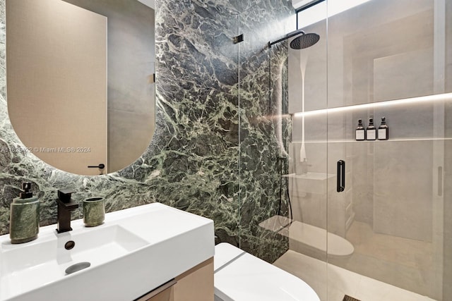 bathroom featuring decorative backsplash, a shower with shower door, tile walls, and toilet