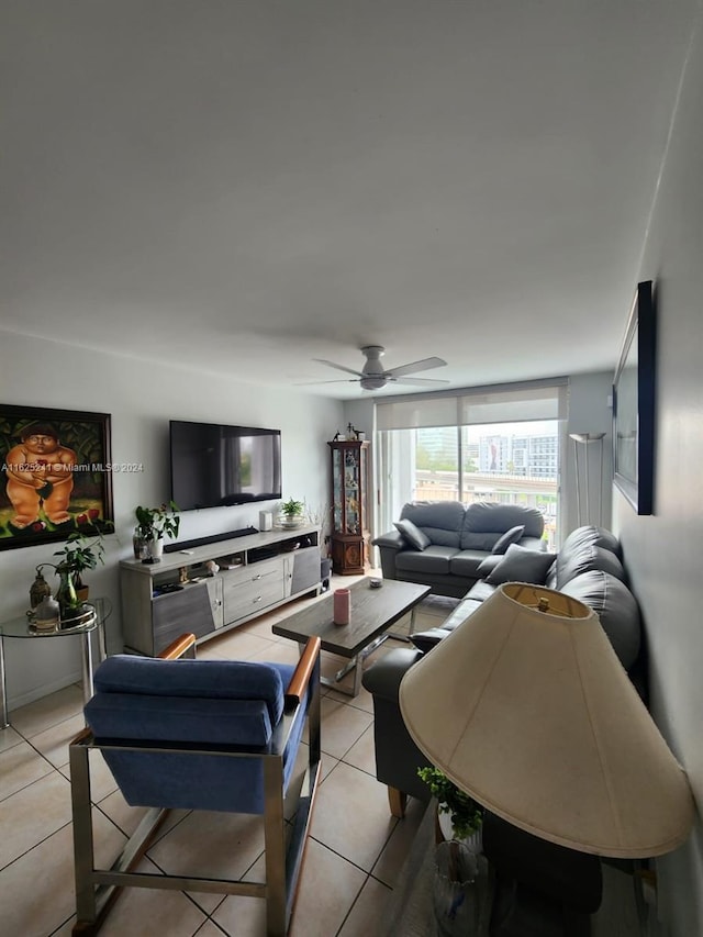 living room featuring light tile patterned flooring and ceiling fan