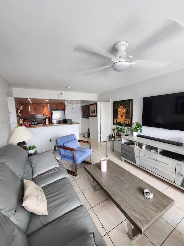 tiled living room featuring ceiling fan