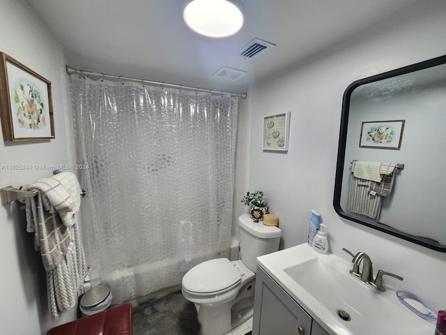 full bath with visible vents, toilet, vanity, and shower / tub combo