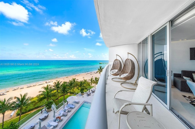 balcony with a view of the beach and a water view