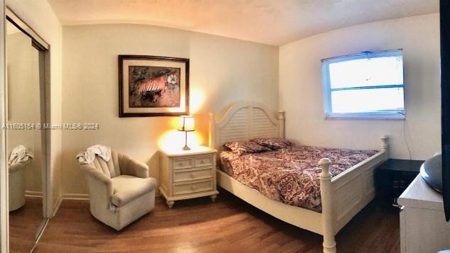 bedroom featuring a closet and wood-type flooring