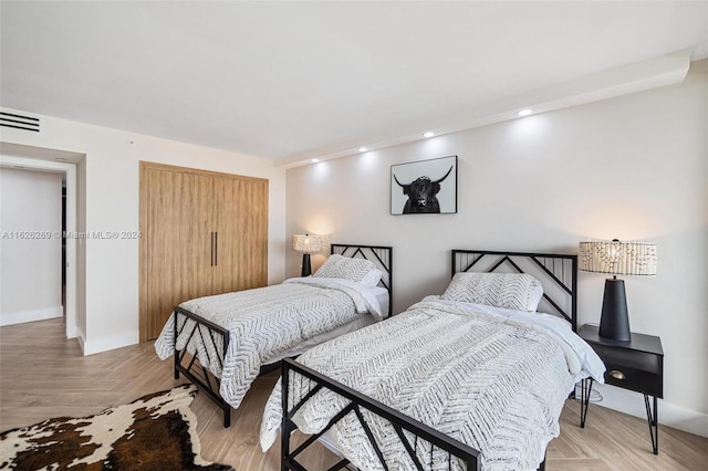 bedroom featuring light parquet floors