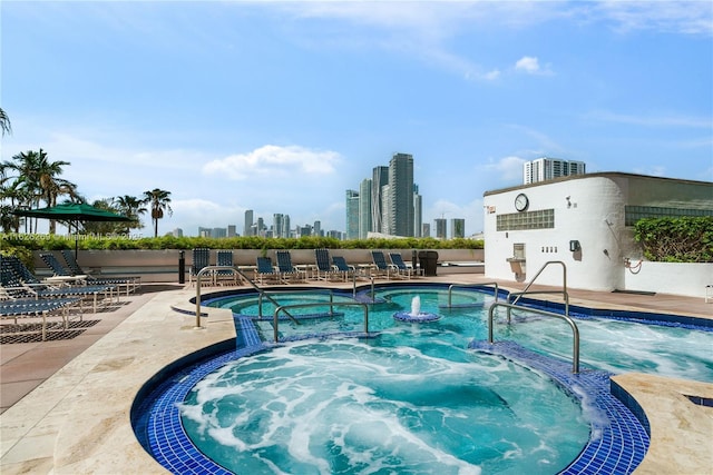 1717 N Bayshore Dr Unit A-3755, Miami, FL 33132 - community pool with a community hot tub, a skyline view, and a patio