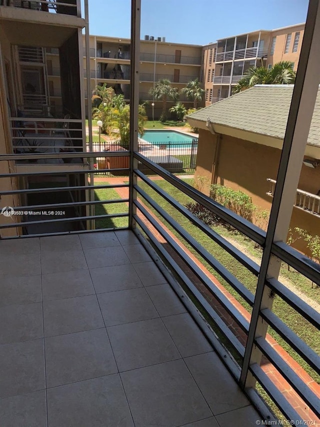 balcony featuring a community pool