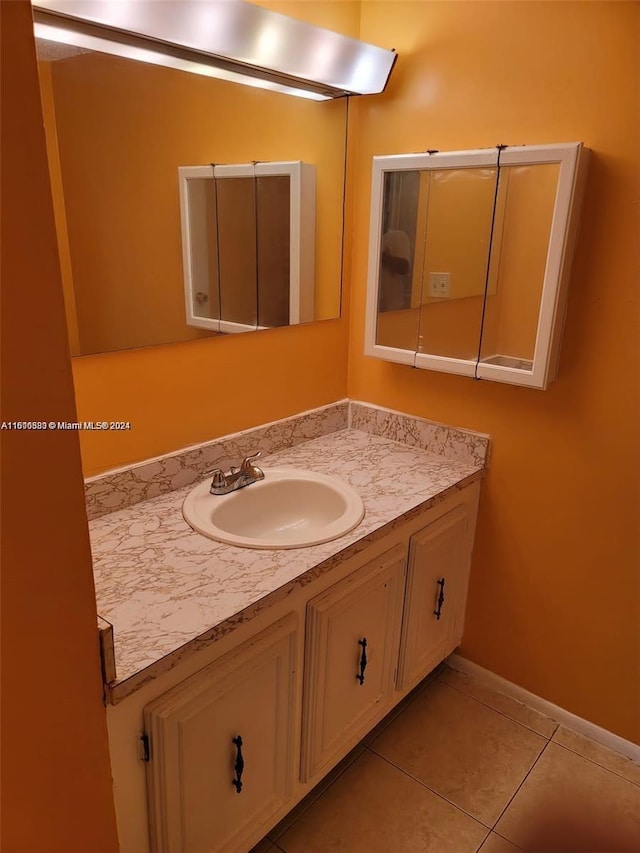 bathroom with vanity and tile patterned flooring