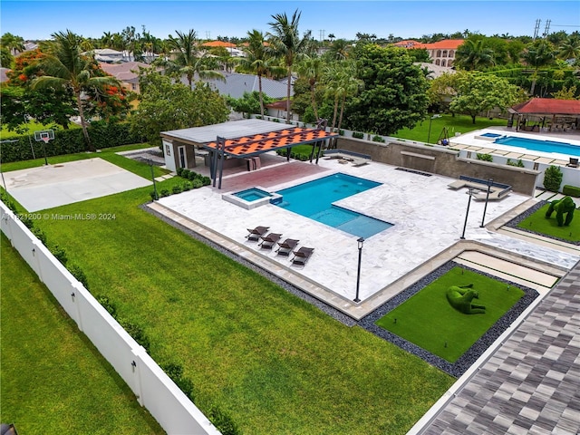 view of swimming pool featuring a pergola, a patio area, and a lawn