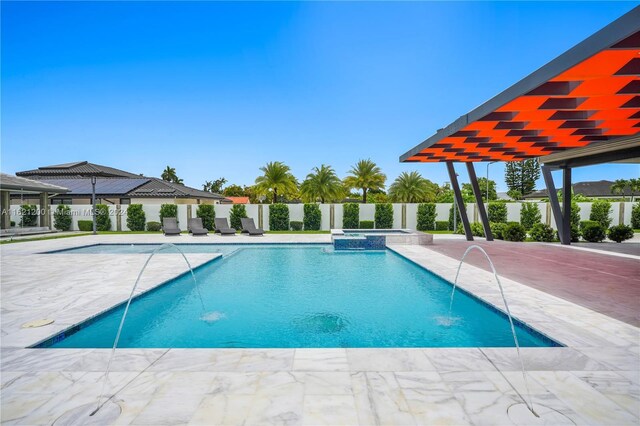 view of swimming pool featuring a patio area and pool water feature