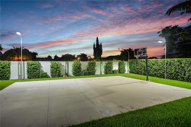 patio terrace at dusk with basketball court