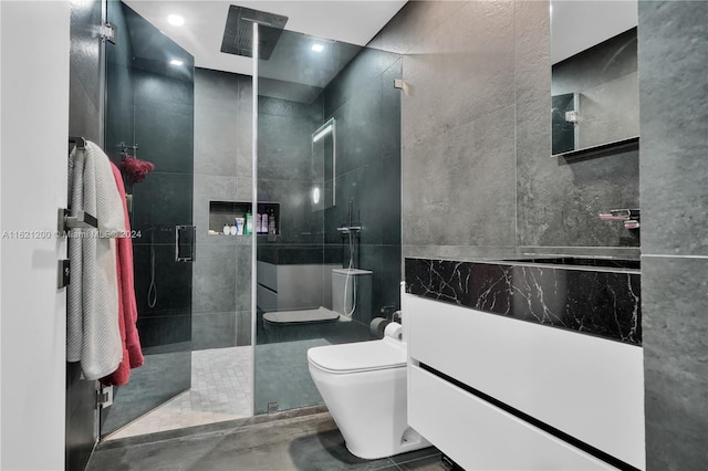 bathroom featuring vanity, toilet, and an enclosed shower