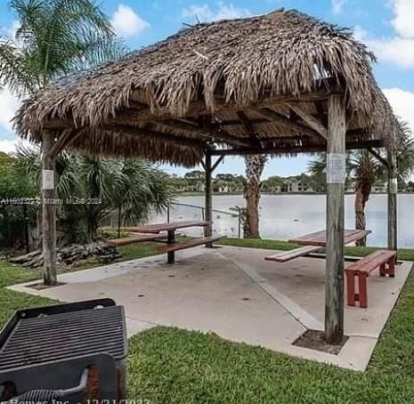 view of community with a water view and a gazebo