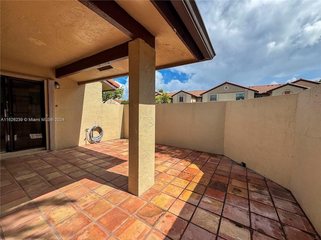 view of patio featuring fence