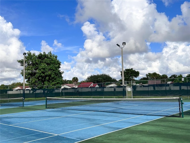 view of sport court with fence