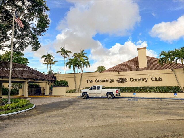 view of building exterior featuring uncovered parking