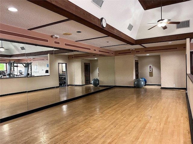 workout room with visible vents and wood finished floors