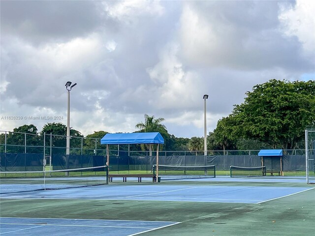 view of sport court with fence