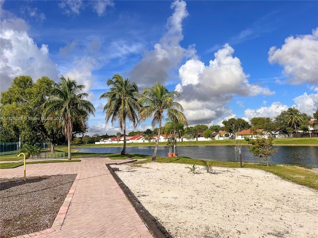 view of community featuring a water view and volleyball court