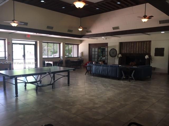 playroom with high vaulted ceiling and visible vents