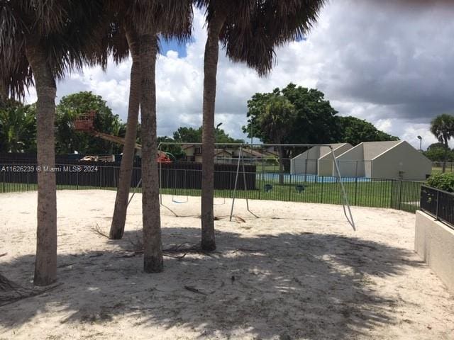 exterior space with fence and volleyball court