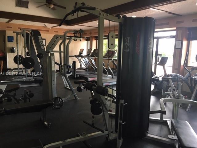 workout area with ceiling fan and visible vents