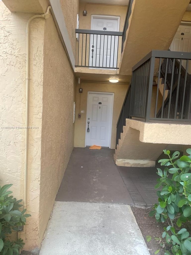 property entrance with a balcony