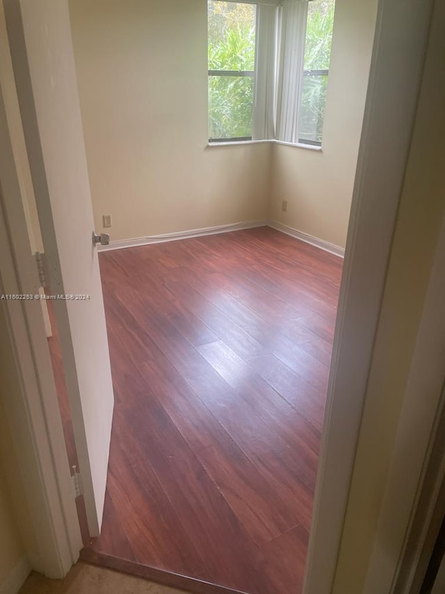 empty room featuring hardwood / wood-style floors