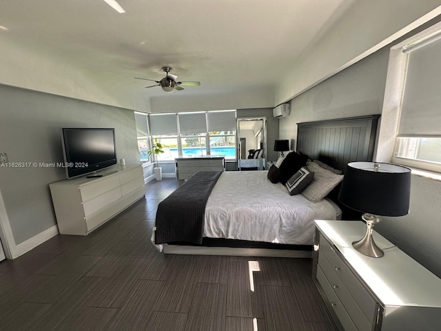 bedroom featuring an AC wall unit and ceiling fan