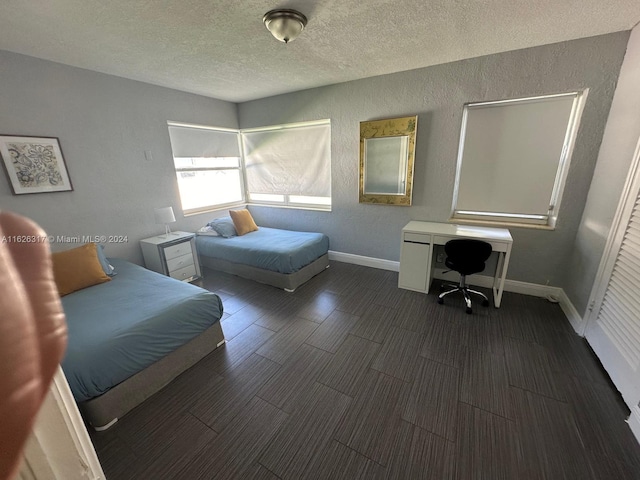 bedroom featuring a textured ceiling