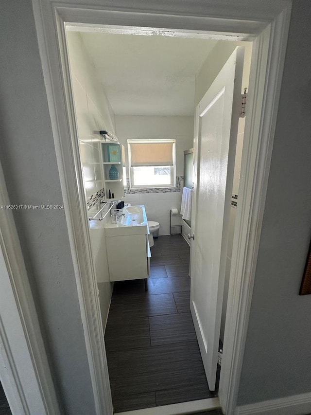 bathroom featuring vanity and toilet