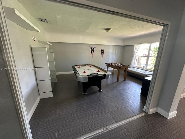 rec room with tile patterned flooring