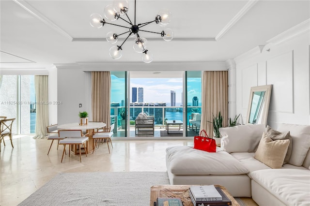 tiled living room with a raised ceiling, crown molding, and an inviting chandelier