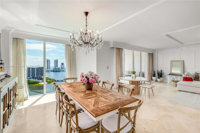 dining room with a city view and a notable chandelier