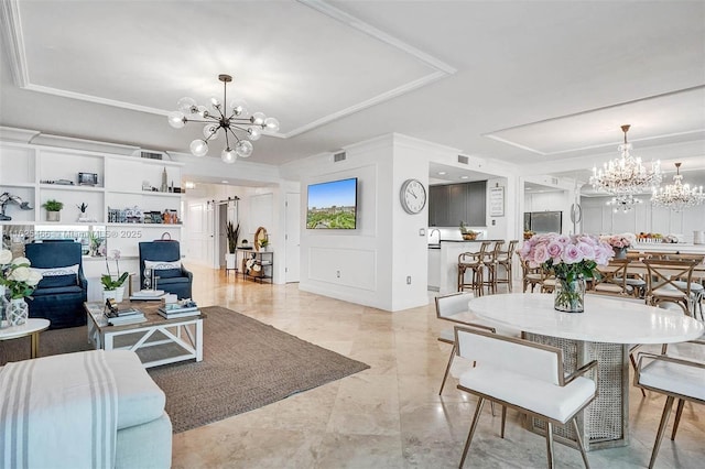 living room with a chandelier, visible vents, and a raised ceiling