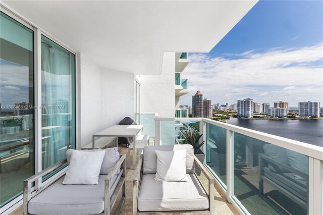 balcony featuring a water view