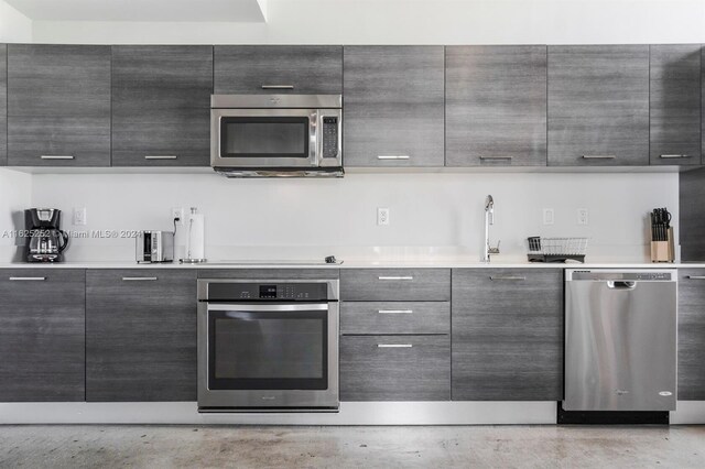 kitchen featuring stainless steel appliances and sink