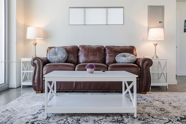 living room featuring concrete flooring