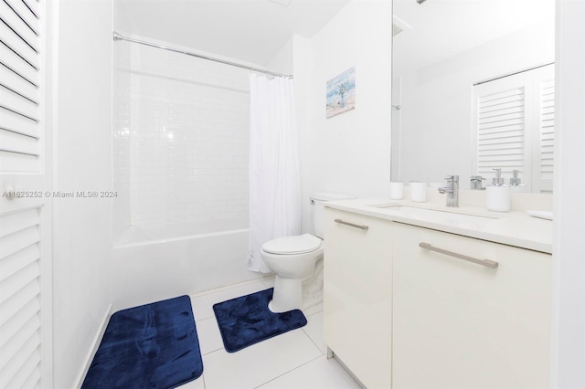 full bathroom with tile patterned flooring, vanity, shower / tub combo with curtain, and toilet