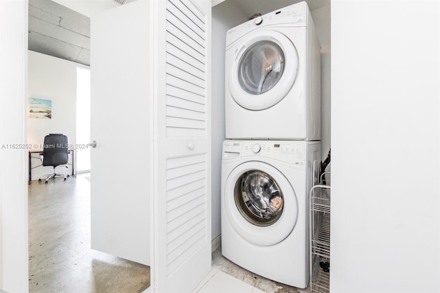 washroom with stacked washer and clothes dryer