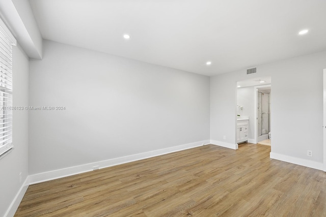 spare room with light hardwood / wood-style floors