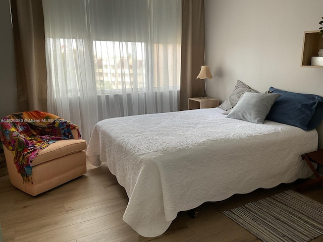 bedroom featuring hardwood / wood-style floors